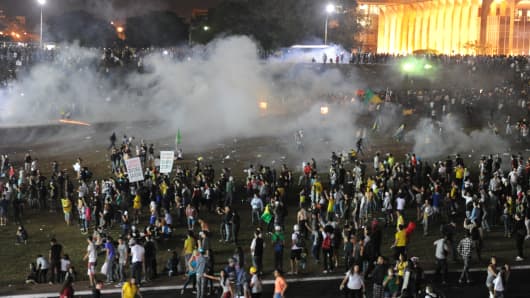 Police employ tear gas against demonstrators during a protest against government waste,corruption and the use of public funds in Brazil on Wednesday.