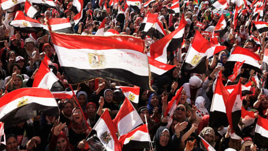 Egyptian opposition protesters chant during a demonstration in Tahrir Square as part of the 'Tamarod' campaign in Cairo, Egypt.