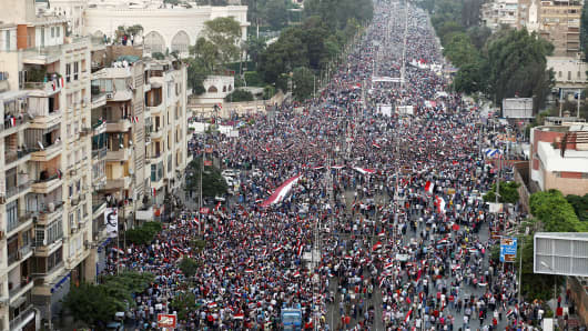 Hundreds of thousands of Egyptian demonstrators gather at the presidential palace during a protest calling for the ouster of President Mohamed Morsi on July 1, 2013 in Cairo.