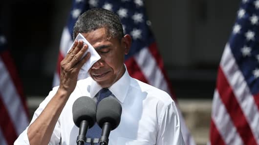 President Barack Obama feels the heat as he unveils his plan on climate change June 25 at Georgetown University in Washington.