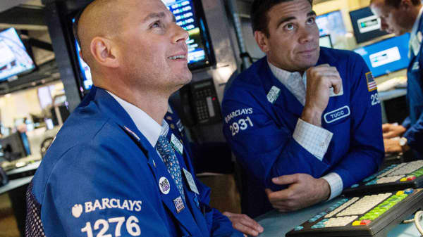 Reusable: NYSE traders exchange happy looking at markets