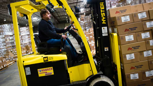 An employee operates a forklift at the distribution center of the Oregon Freeze Dry facility in Tangent, Oregon.