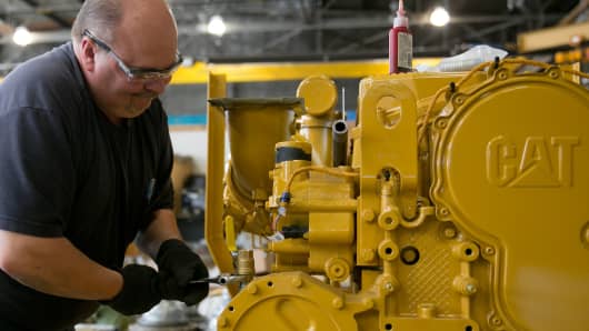 An employee pre-assembles a Caterpillar engine at the Ellicott Dredges facility in Baltimore.