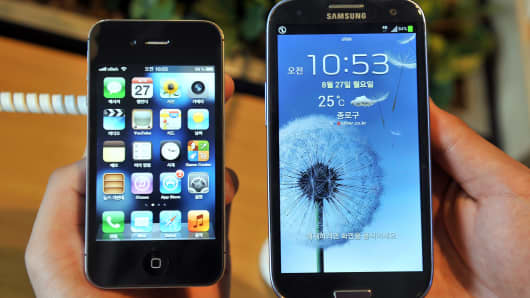 A Samsung Galaxy S4 and an Apple iPhone 5