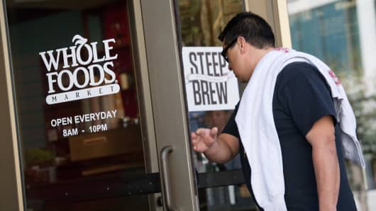 A customer enters a Whole Foods Market Inc. store in San Francisco, California.