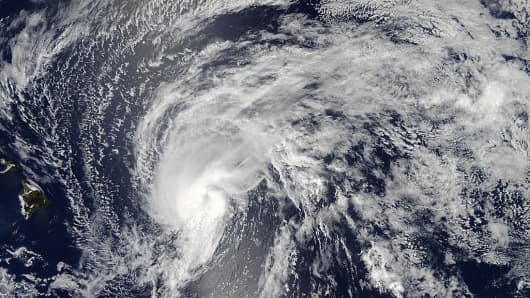 The MODIS instrument that flies aboard NASA's Aqua satellite captured this image of Tropical Storm Flossie on July 28 at 23:10 UTC (7:10 p.m. EDT) as it continued moving toward Hawaii (left).