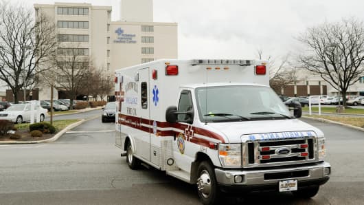 An ambulance leaves Community Health's Pottstown Memorial Hospital in Pottstown, Pennsylvania.