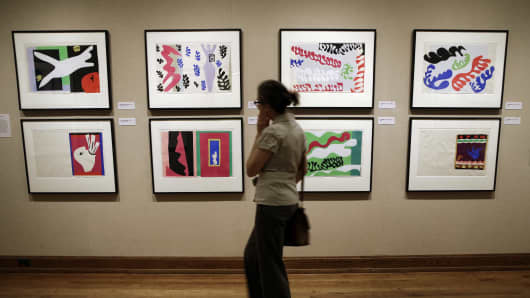 A viewer looks at The Detroit Institute of Arts display of nearly all of the works in its collection by Pablo Picasso and Henri Matisse.