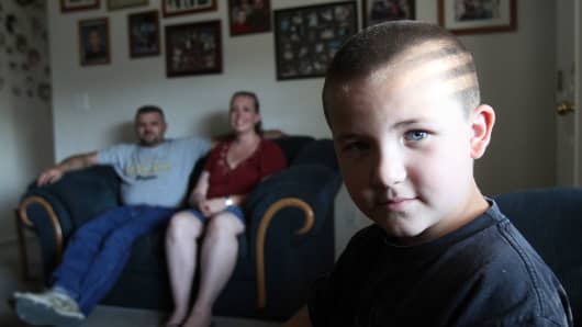 Kati and Jason Criner with their six-year-old son Terry at their home in Boise, ID