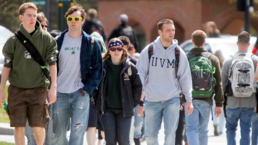 Students walk across campus at the University of Vermont in Burlington.