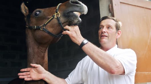 The head of cloning company Cryozootech, Eric Palmer, posing with a cloned horse Pieraz-Cryozootech-Stallion during its presentation to the press. The horse is a pure-bred Arab, from a castrated endurance champion, Pieraz.