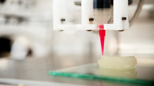 A 3-D printer being used to engineer a new ear.