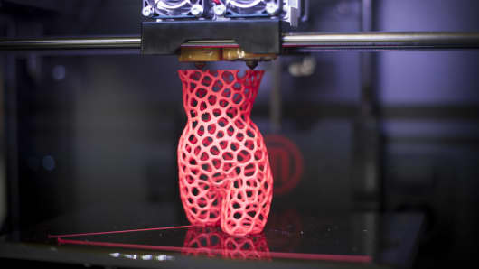 3-D printer creates a sculpture of a woman at the DMY International Design Festival at the former Tempelhof Airport Hangar on June 5, 2013 in Berlin, Germany.