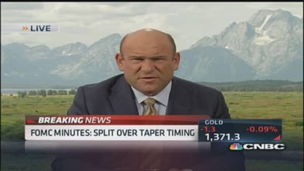 FOMC split over taper timing