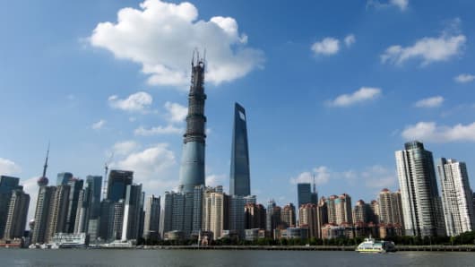 The Shanghai Tower (L), China's tallest building.