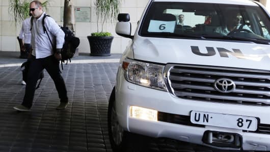 The UN chemical weapons investigation team arrives in Damascus.