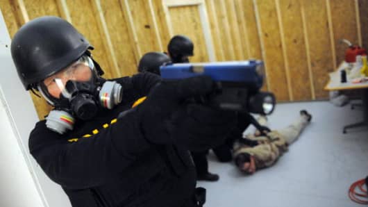 US Drug Enforcement Administration (DEA) Agents simulate a raid in their Tactical Training Facility