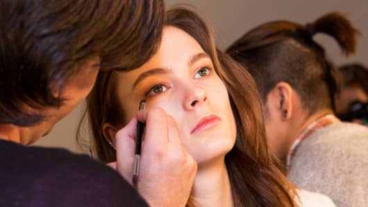 Make-up applied to a model backstage at New York Fashion Week.