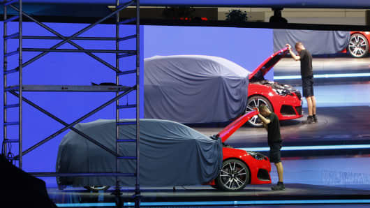A partially covered Vauxhall at the 2013 Frankfurt International Motor Show
