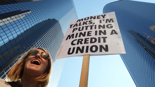 Protest against banks and in favor of credit unions.