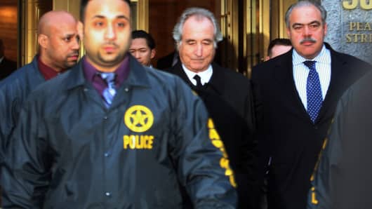 Bernard Madoff walks out of federal court after a bail hearing in New York on Jan. 5, 2009.