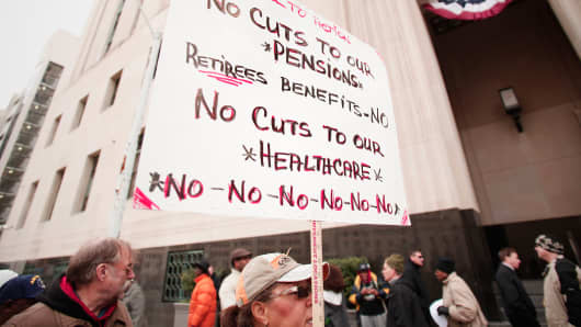 Protestors rally in front of the U.S. Courthouse in Detroit, October 28, 2013.