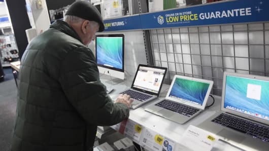 A customer looks at computers at a Best Buy store in Northbrook, Ill.