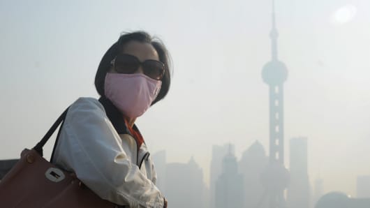 A woman wearing a mask in Shanghai.