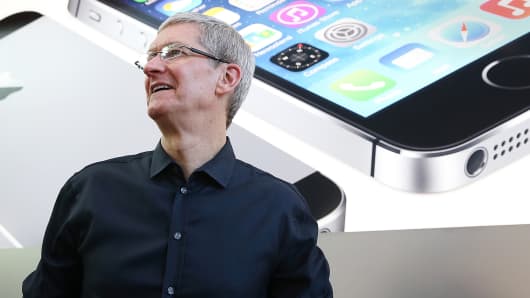 Apple CEO Tim Cook looks on at an Apple Store on September 20, 2013 in Palo Alto, California.