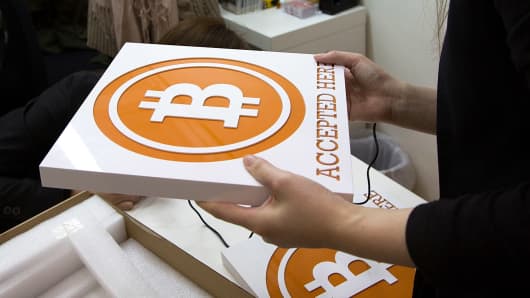 People attend a bitcoin retail store opening in Hong Kong.