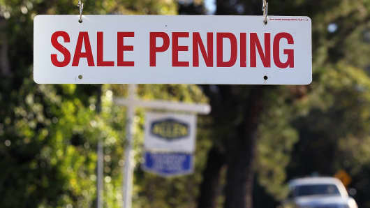 A sale pending sign is posted in front of home for sale in Greenbrae, California.