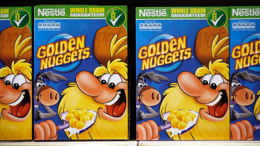 Packets of Nestle Golden Nuggets whole grain breakfast cereal, produced by Nestle SA, sit displayed for sale inside a supermarket in London, U.K., on Tuesday, Feb. 11, 2014.