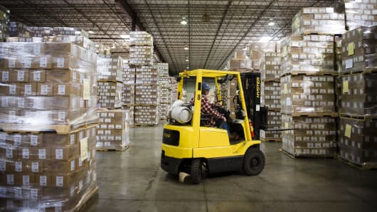 An employee operates a forklift at the distribution center of the Oregon Freeze Dry facility in Tangent, Oregon.