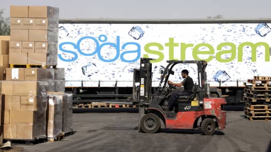 An employee uses a forklift truck to prepare pallets of SodaStream products for export at the SodaStream International Ltd. factory in Mishor Adumim, near Jerusalem, Israel.