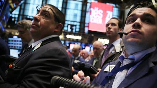 Traders work the floor of the New York Stock Exchange.
