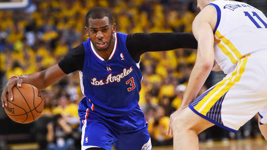 Chris Paul #3 of the Los Angeles Clippers drives on Klay Thompson #11 of the Golden State Warriors in Game Four of the Western Conference Quarterfinals during the 2014 NBA Playoffs at ORACLE Arena on April 27, 2014 in Oakland.