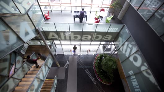 People walk through Alibaba.com Ltd.'s headquarters in Hangzhou, Zhejiang Province, China.
