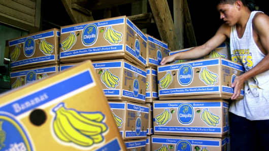 Sergio Medina carries boxes in the Chiquita banana packing plant located on the Bueso plantation in La Lima, Honduras.