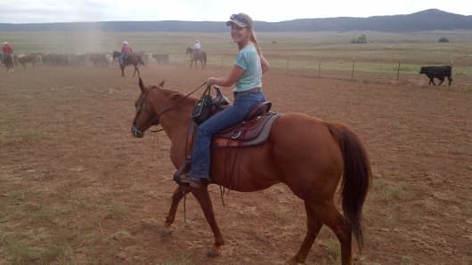 Andrea Sloan enjoying time with her beloved horse Heathen.