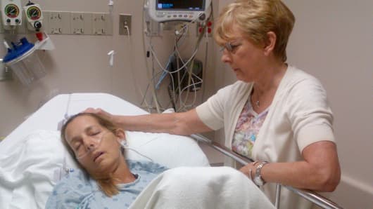 Andrea Sloan, an ovarian cancer patient, in the hospital with her mother.