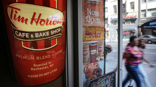 Burger King is in talks to acquire Canadian chain Tim Hortons.