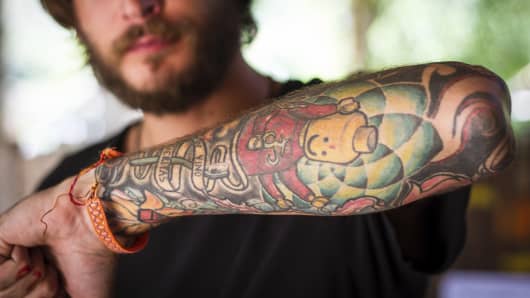 Man with tattooed arm