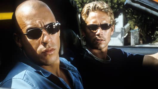 Vin Diesel, left, and Paul Walker are shown in a scene from the film “The Fast And The Furious.”