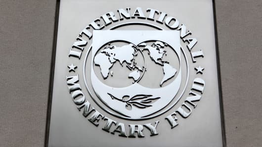 The International Monetary Fund (IMF) logo is seen at the IMF headquarters building in Washington.