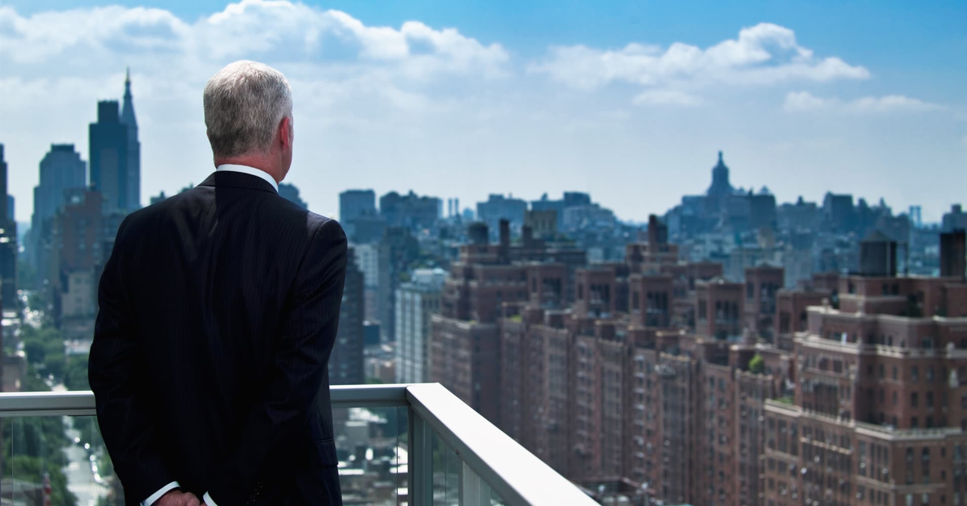  older man overlooking New York City, New york apartment, NYC apartment