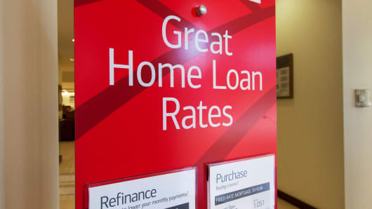 A sign advertising home loan rates for purchase or refinancing at a Bank of America in New York.