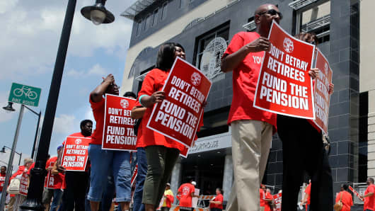 Union members protest New Jersey Gov. Chris Christie's plan to use pension payments to balance the budget in June of last year.