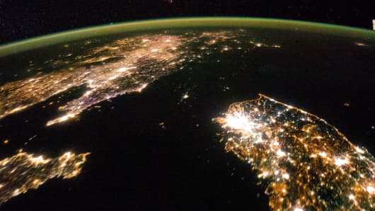 Flying over East Asia in January 2014, astronauts took this night image of the Korean peninsula. Dark North Korea is difficult to detect, between China and South Korea.
