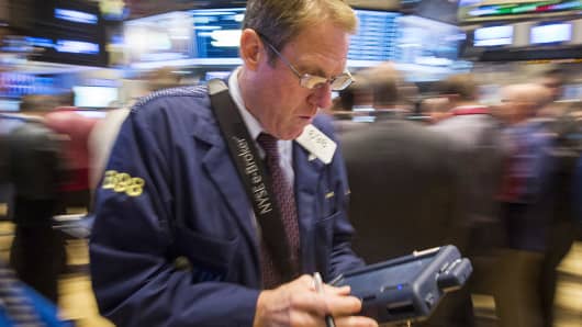 Traders work on the floor of the New York Stock Exchange, Oct. 29, 2014.
