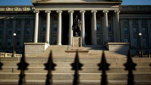 A statue of the first secretary of the Treasury, Alexander Hamilton, stands in front of the U.S. Treasury Department building in Washington.